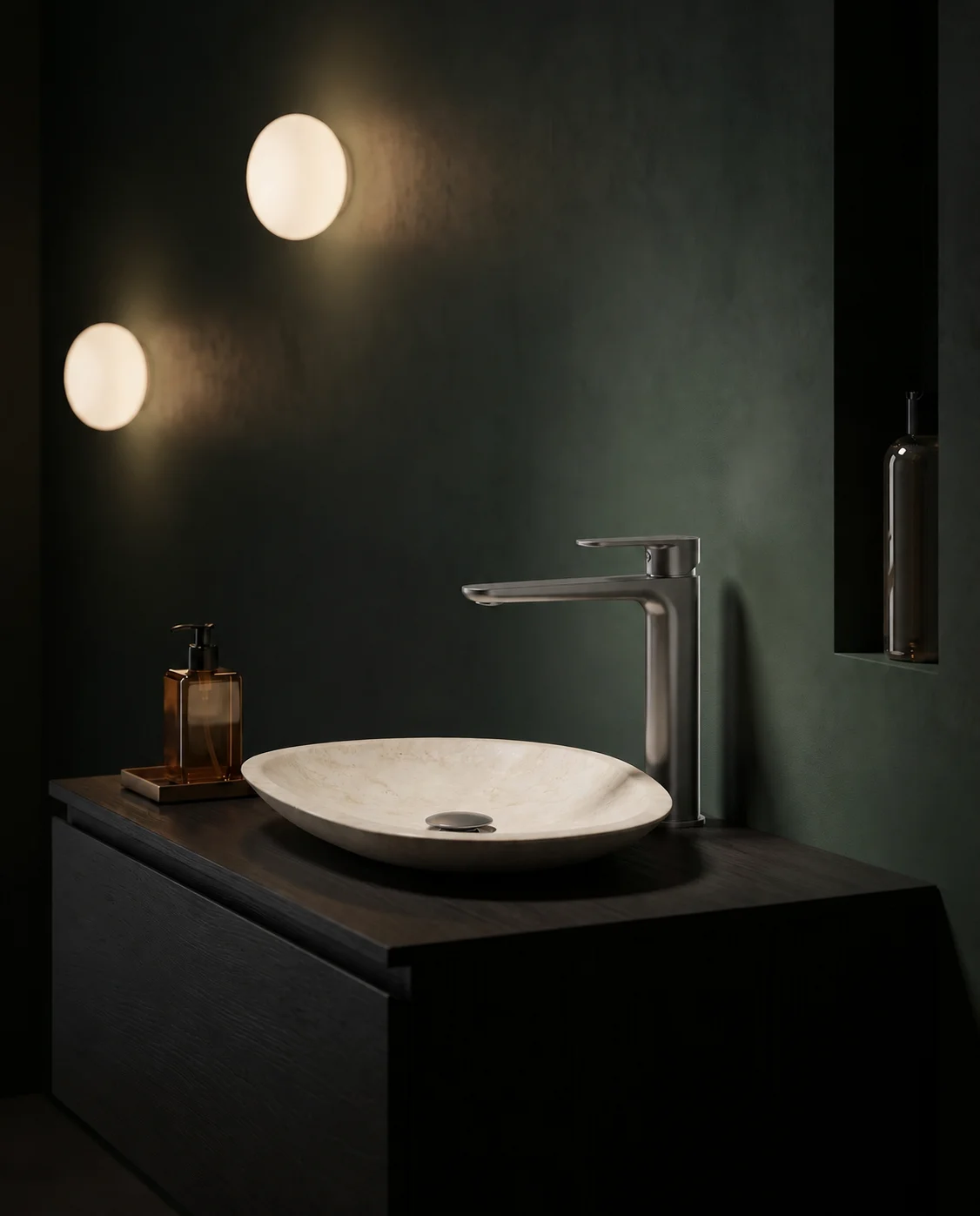 Gun grey Tala mixer with a stone bowl in a dark green hotel bathroom