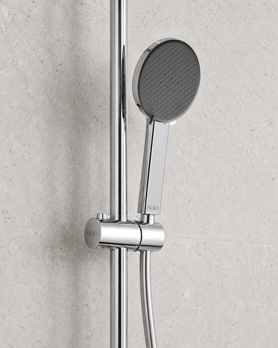 Close-up of the chrome Dana hand shower in its sliding holder
