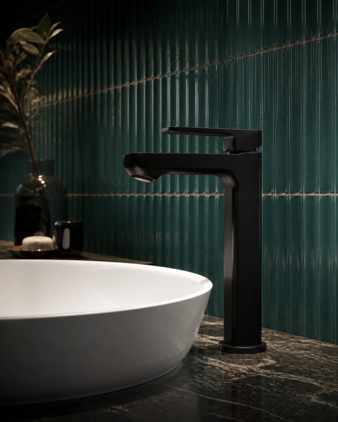 Low angle of the matte black Tala mixer beside a white vessel basin and fluted deep-teal wall