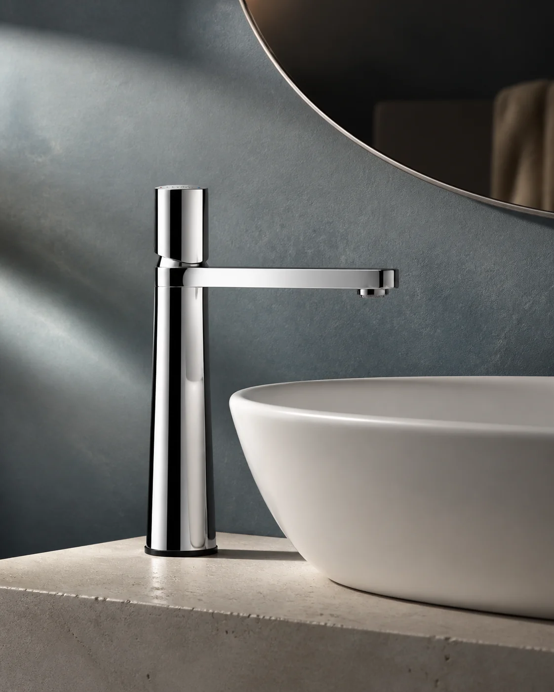 Low angle of the chrome Lian mixer with a white bowl and smoky blue wall