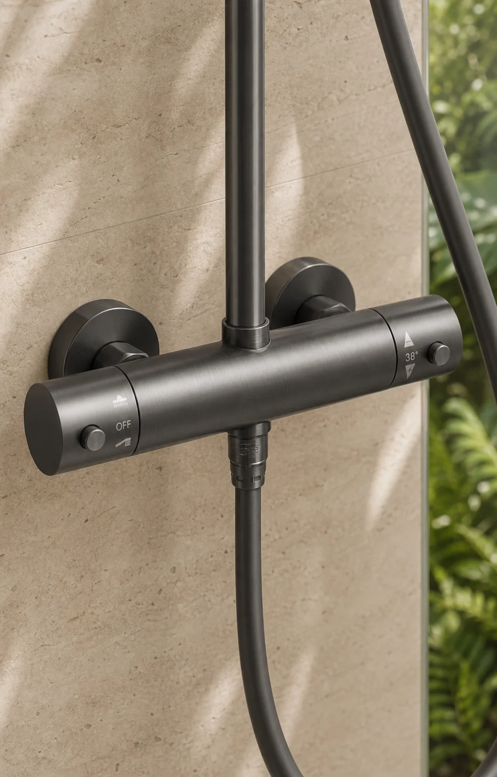 Close-up of the gun grey Rima thermostatic bar mixer on travertine